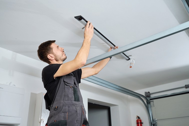 Technician performing emergency garage door repair Reseda on residential garage door system