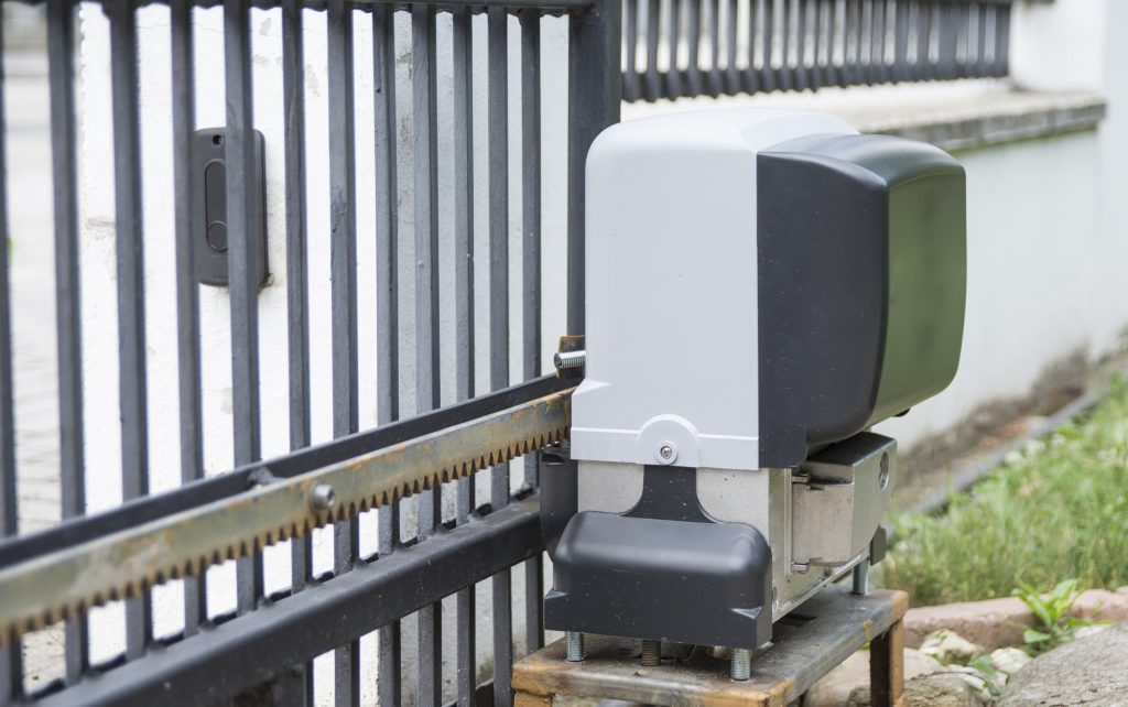 Technician performing automatic gate repair Reseda on sliding gate system