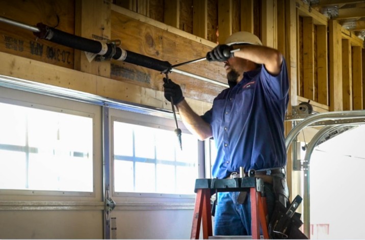 Professional garage door service Tarzana technician repairing residential garage door