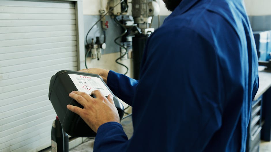 Technician performing garage door keypad repair Tarzana on residential garage door keypad